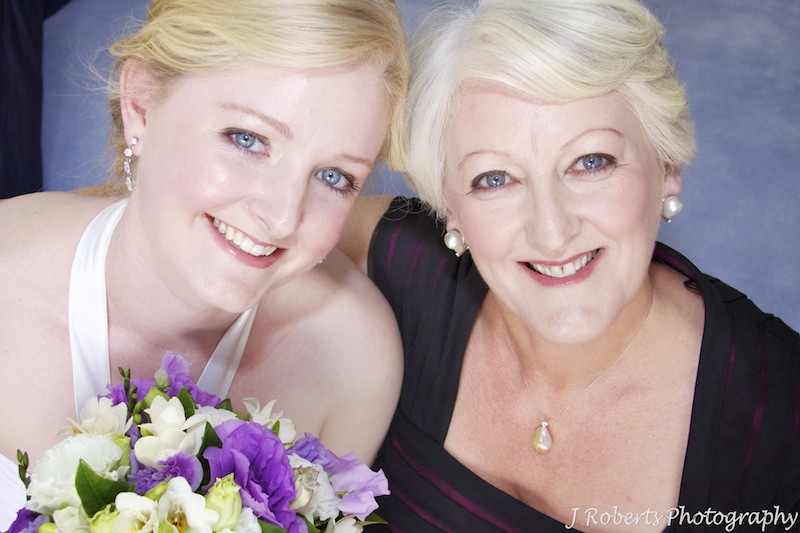 Bride and her mother beaming at the camera - wedding photography sydney